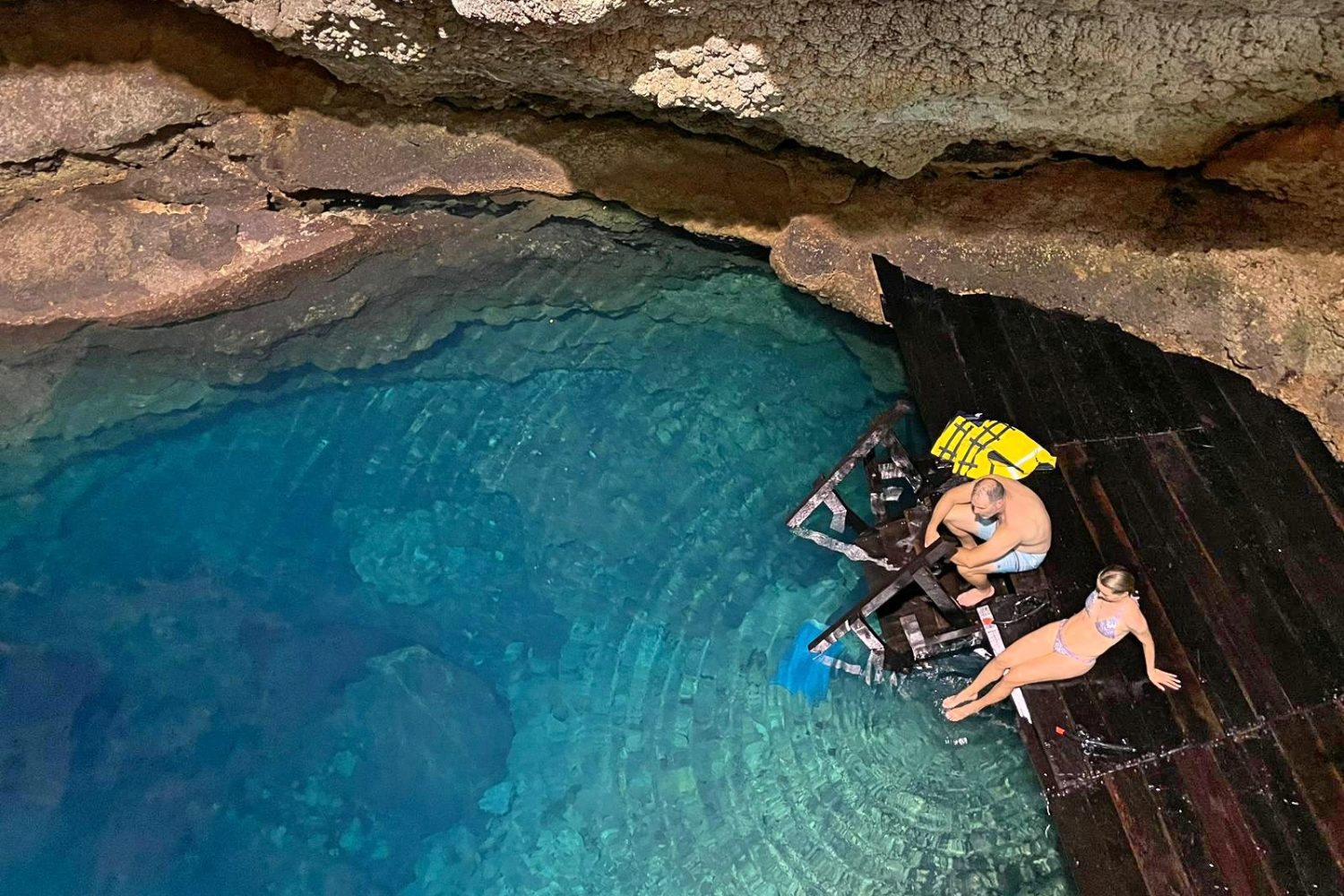 Couple relaxing at Cenote Tankach-Ha during a Coba and Cenote Private Tour by The Custom Tour Riviera Maya